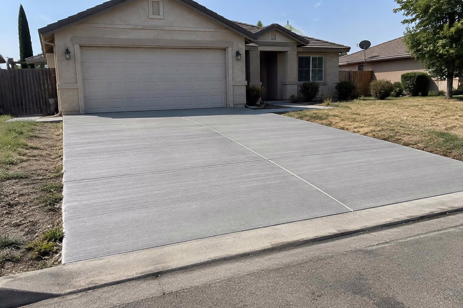 Broom-finish concrete driveway at a California home